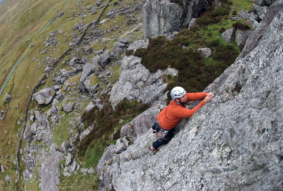 A climber enjoying Kirkus's Climb Direct (S 4a) on Clogwyn yr Oen, Moelwyns. Photo: © Mark Reeves