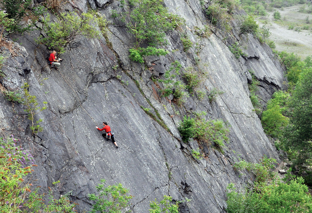 Warming up on a misty morning; Clare Lindley belayed by Brian Mullan on Talk to The Hand (VS 4c). Photo: Mark Davies
